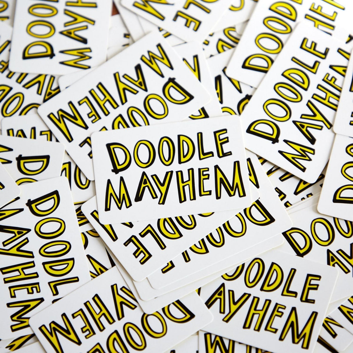 Cards with 'Doodle Mayhem' text - a selection of the 126 prompt cards fanned out