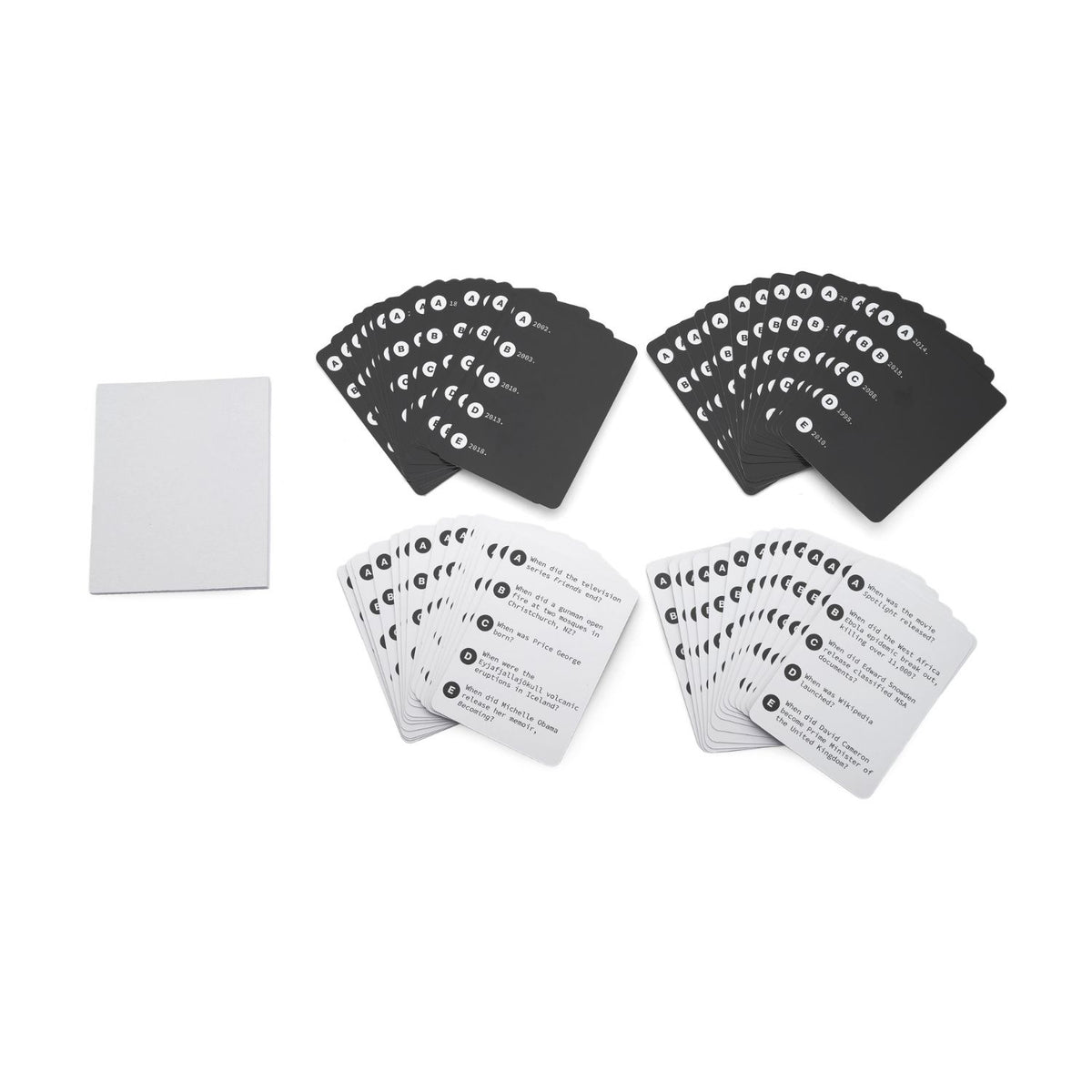 The contents of the trivia game neatly arranged, displaying the large deck of pop culture question cards and the custom scorepad.