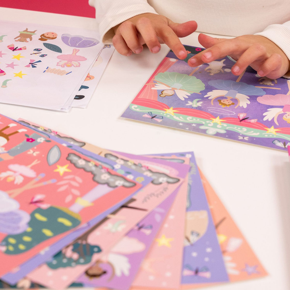 A sticker art book for children with illustrations of fairies and flowers on the cover.