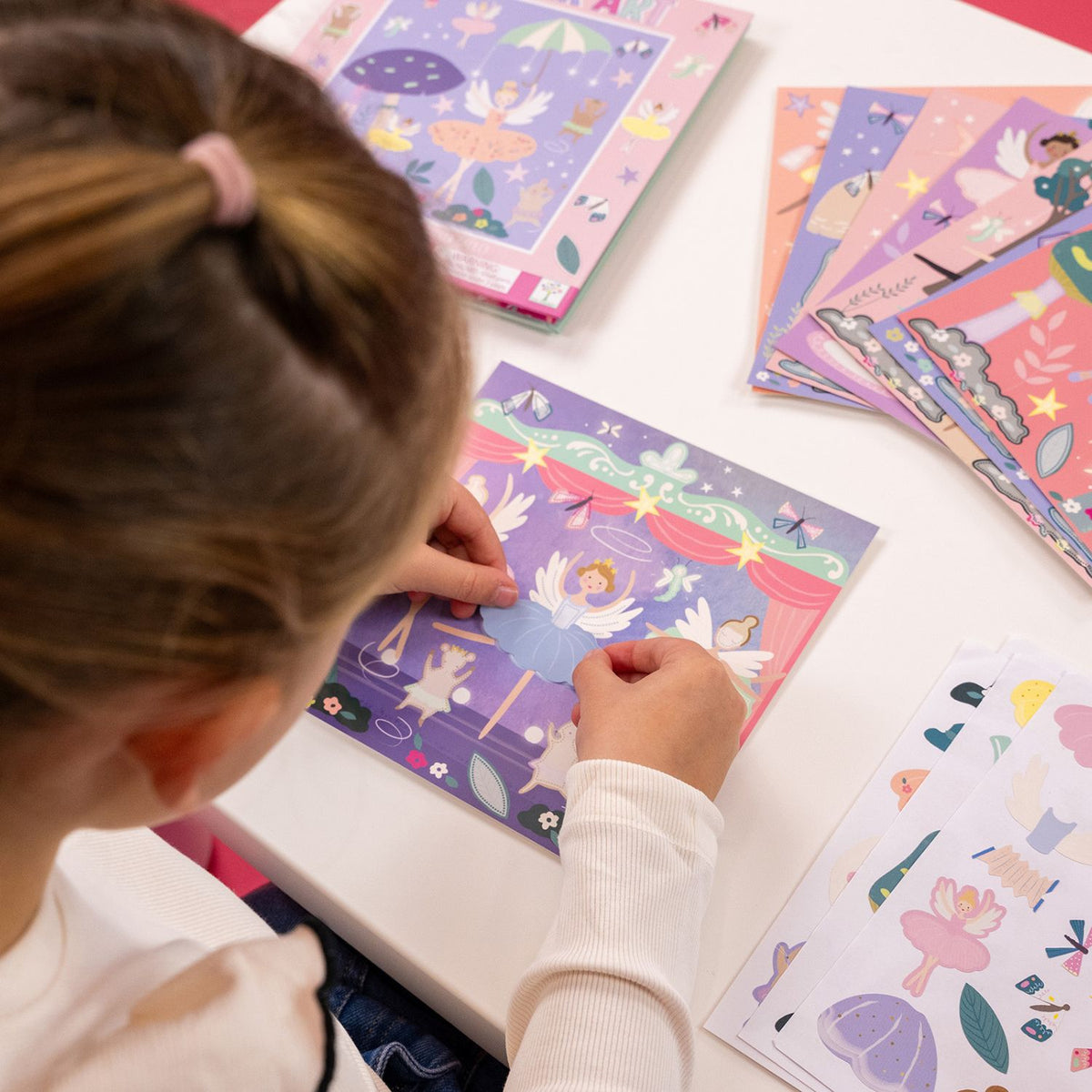 A sticker art book for children with illustrations of fairies and flowers on the cover.