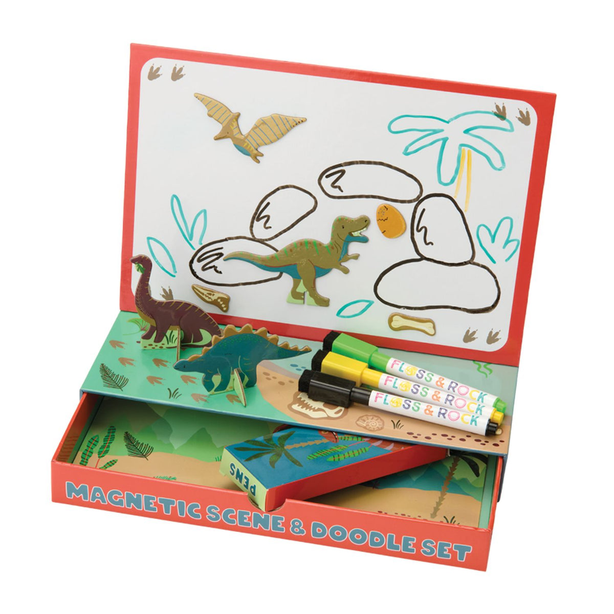 The Floss & Rock Enchanted Magnetic Scene & Doodle Set opened to reveal a colourful forest backdrop, various dinosaur character magnets, and three dry-wipe pens.