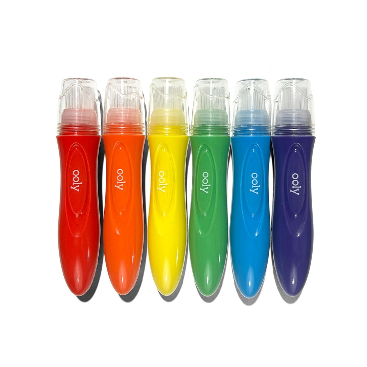 Set of six colorful poster paint brushes with 'ooly' branding 