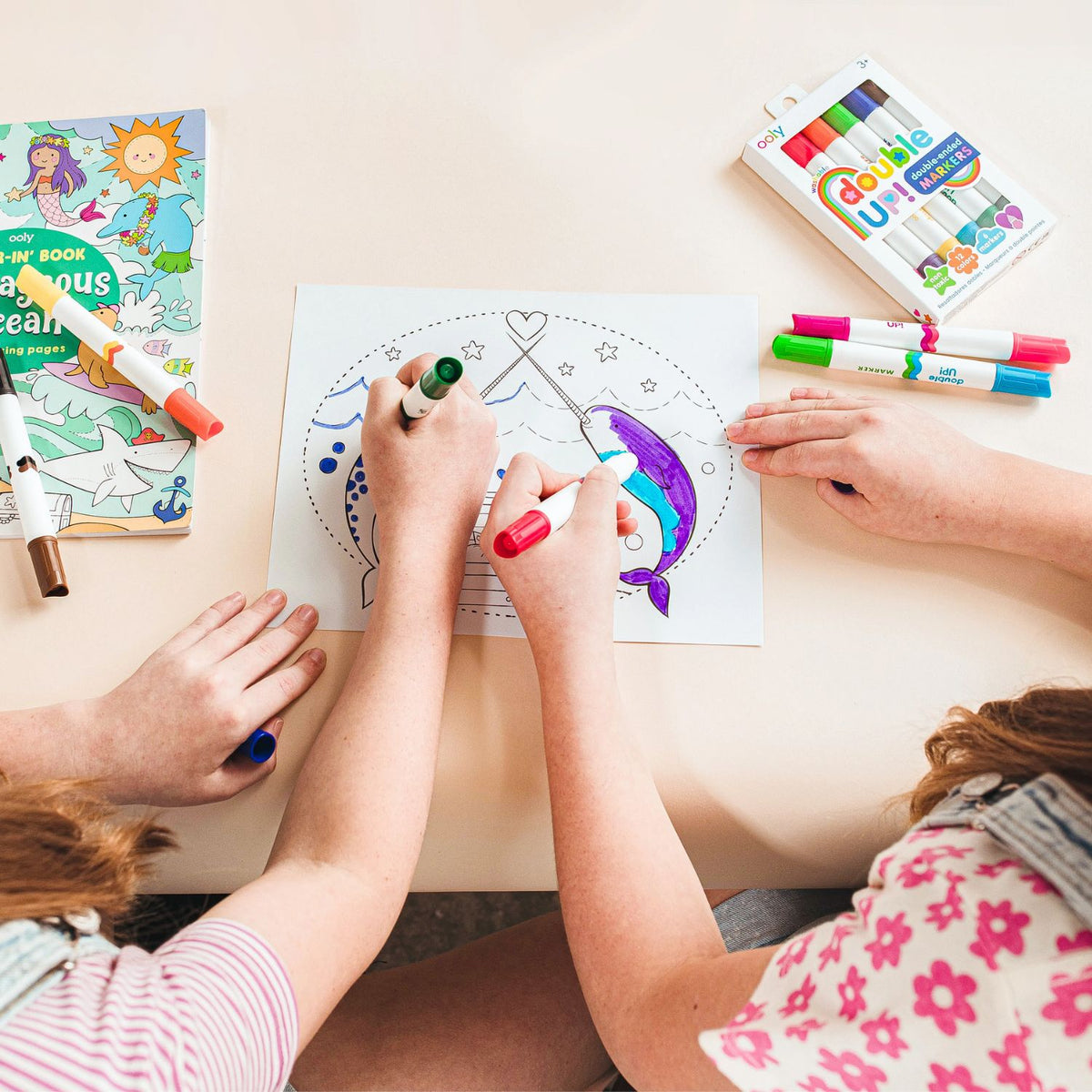 Two children sitting side-by-side sharing the set, illustrating the product’s use in fostering social interaction and collaborative creativity.