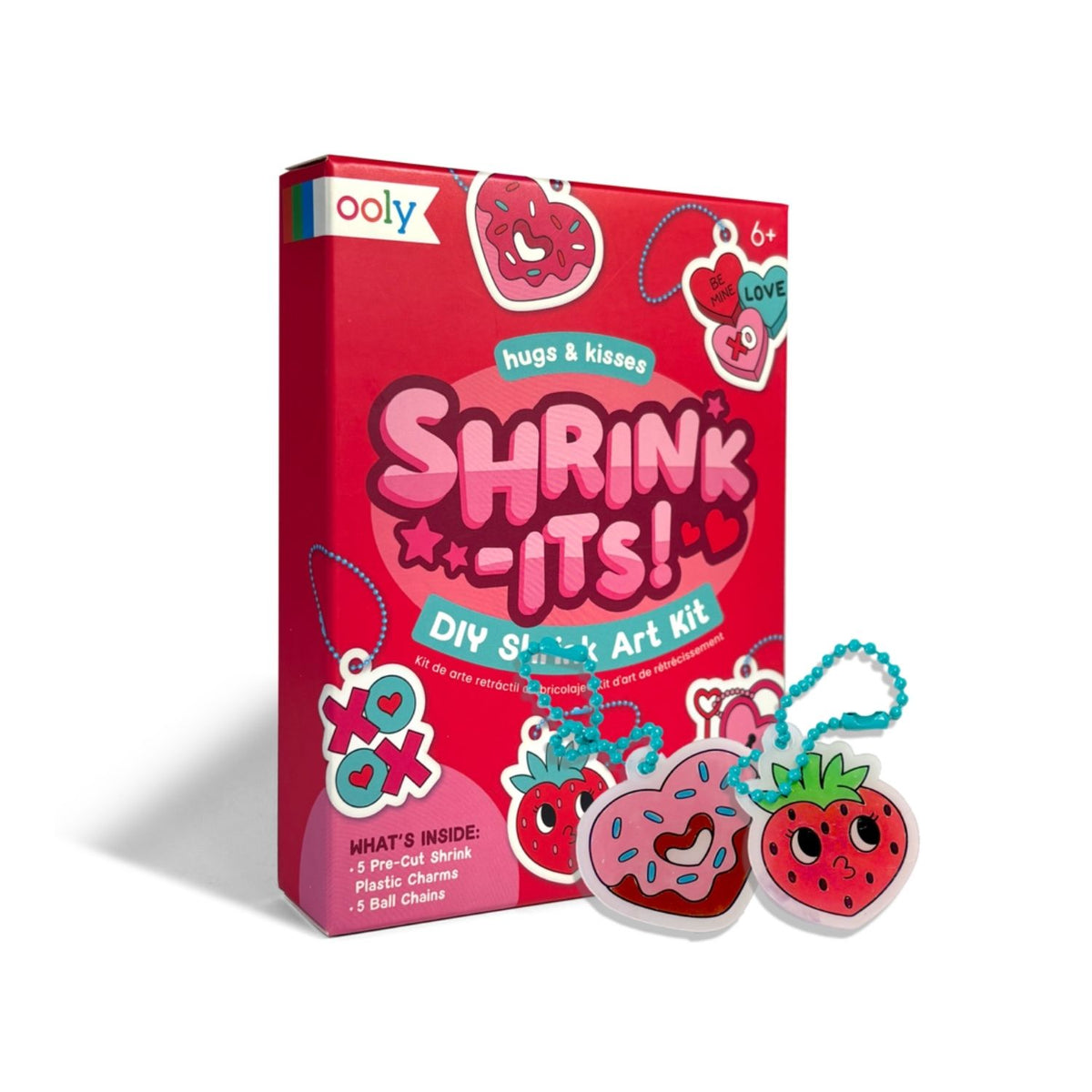 The Mini Shrink-Its! Hugs & Kisses Kit in its "bite-sized" pink and red box, displayed with the five pre-printed shrink sheets and colourful ball chains.