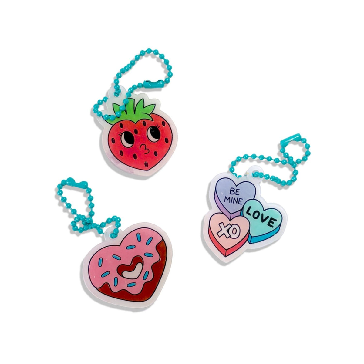 Finished Hugs & Kisses charms attached to matching "best friend" bracelets, illustrating the kit's use for handmade gifting.