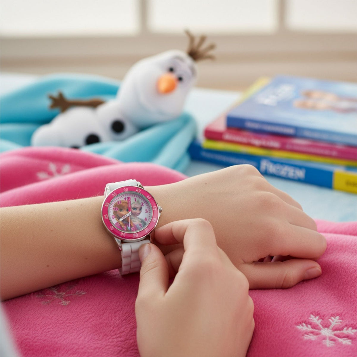 Kids wearing Disney Frozen time teacher watch designed for learning to tell the time